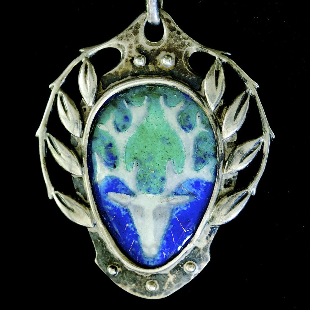 Murrle Bennett, silver and enamel pendant, decorated with a stags head.